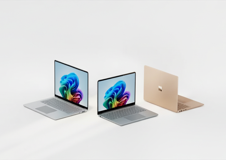 Three Microsoft Surface laptops in different colours